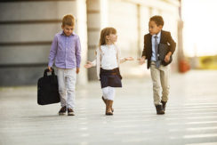 Group of business kids taking a walk outdoors and talking.