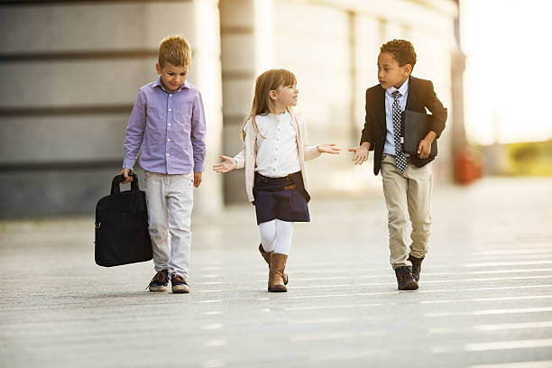 Group of business kids taking a walk outdoors and talking.