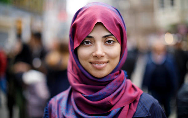 Portrait of smiling muslim woman outdoors